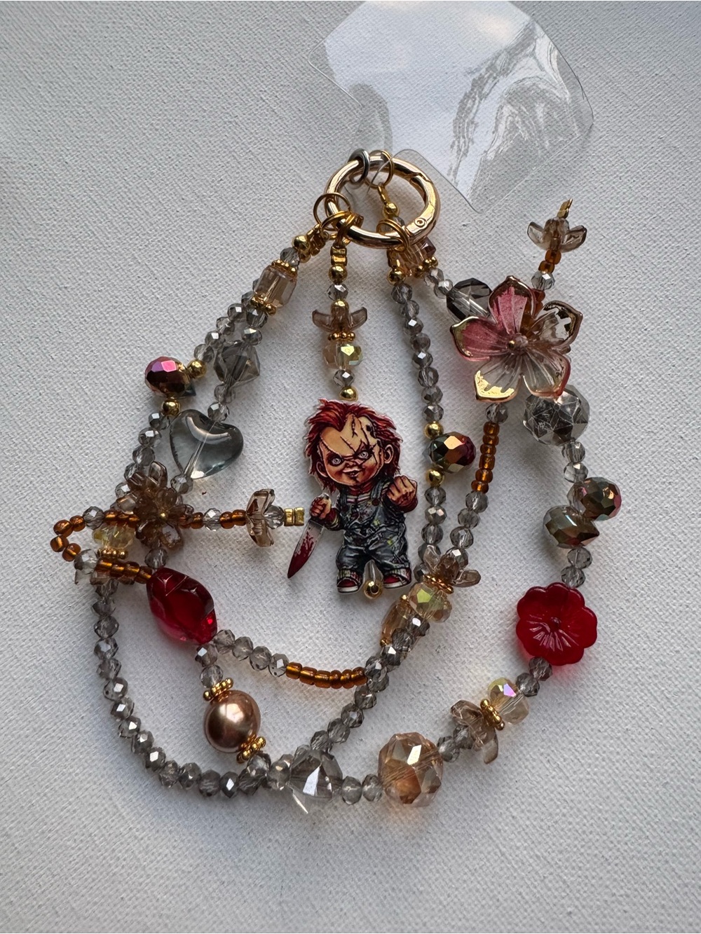 Chucky Gold-Tone Beaded Phone Charm with Red Flower and Grey Beads
